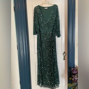 Hunter green sequin mother of the bride dress. Long front slit.